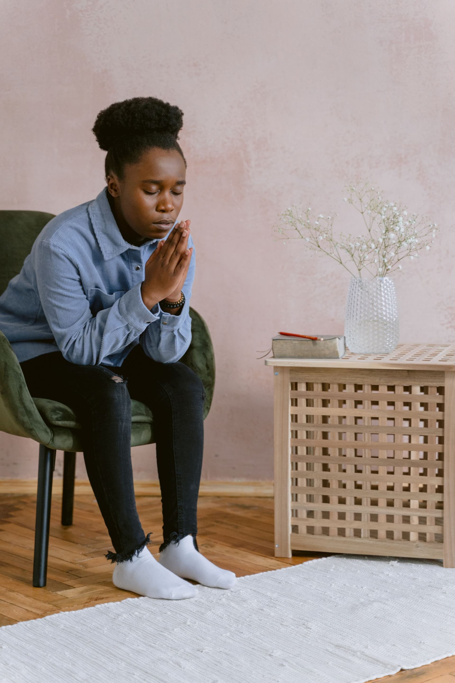 A woman praying at home in the morning